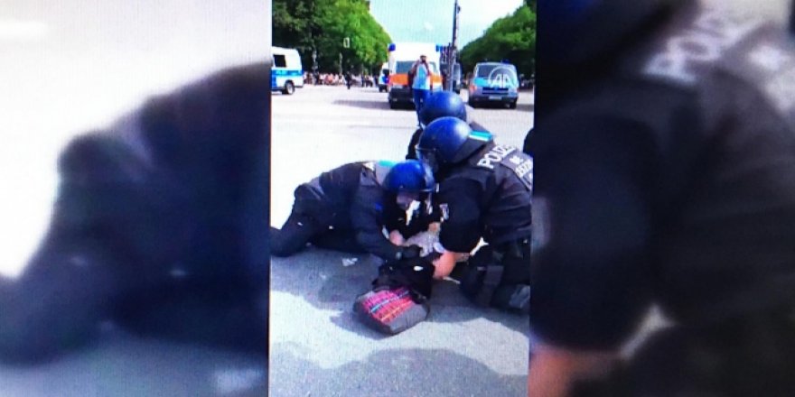 Almanya'da polis kadın protestocuyu yumrukladı