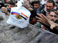 Katliamcı Rusya'dan Halepli Kurbanlarına Yardım Şovu!